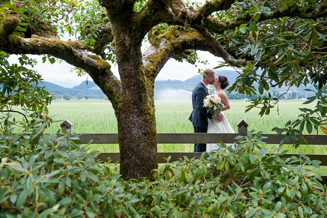 Bride and groom kiss at Maplehurst Farms
