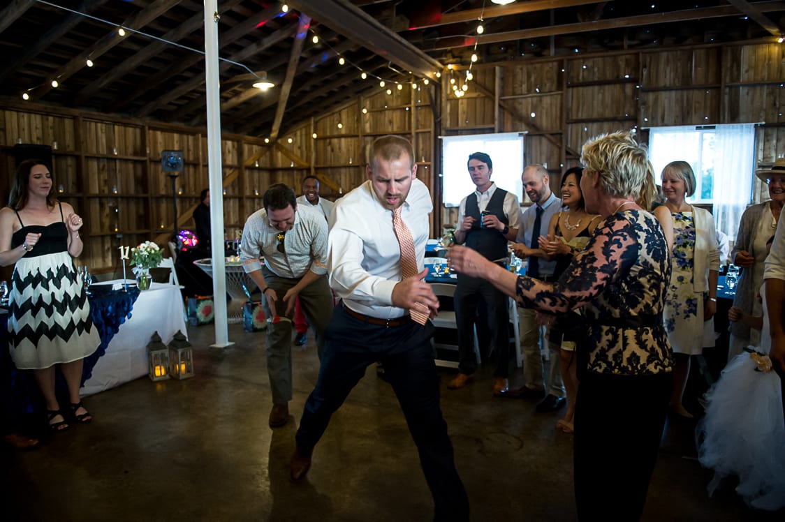 Groomsmen dancing during reception at Maplehurst Farm