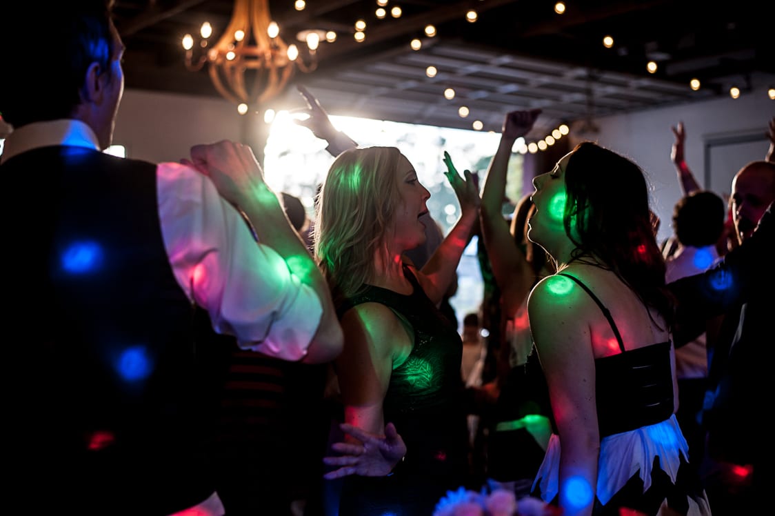 People dancing with DJ lights at Maplehurst Farm