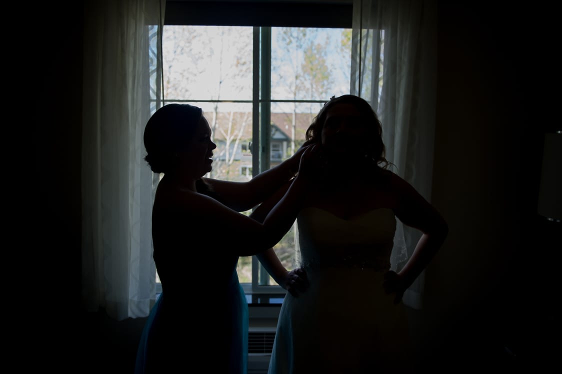 Silhouette of bride getting ready