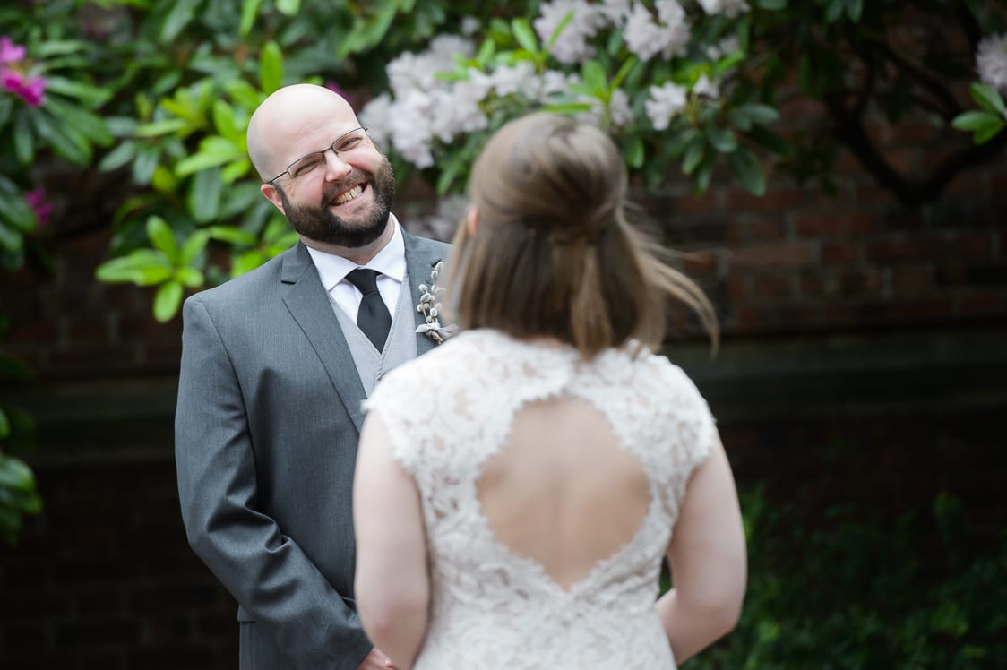 Groom smiling at his bride at the First Presbyterian Church in Tacoma