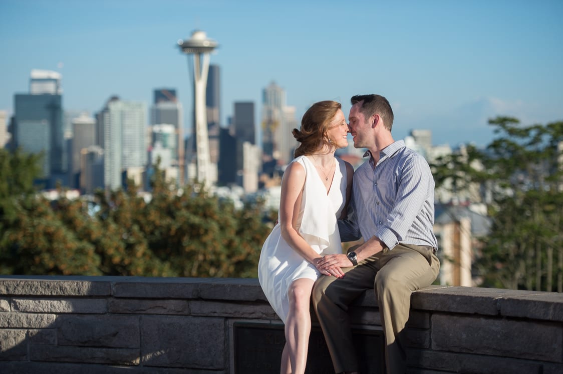 Couple about to kiss with Seattle in the background at Kerry Park in Seattle