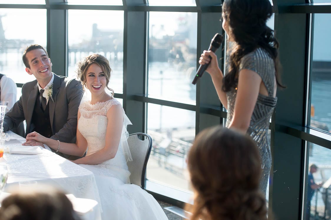  Bride laughing as her sister gives a toast at the Bellingham Cruise Terminal