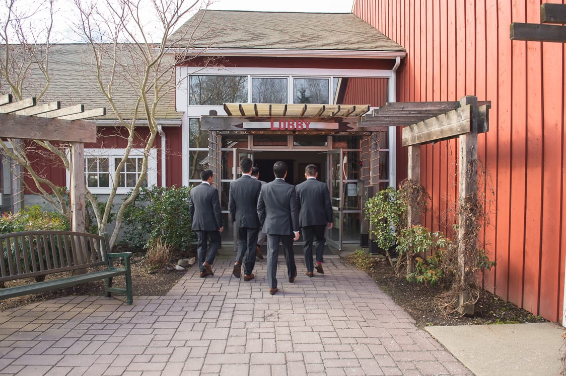 Groomsmen walking into the venue at the Pickering Barn in Issaquah, WA
