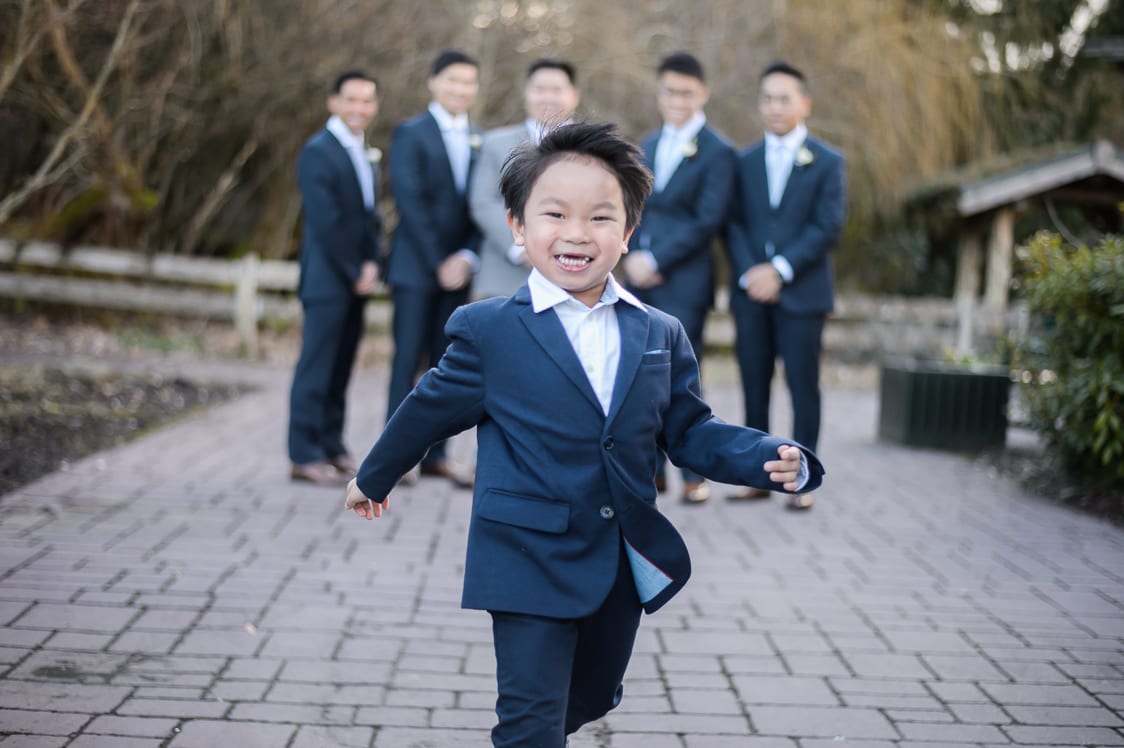 Ring bearer in front of the groomsmen at the Pickering Barn in Issaquah, WA