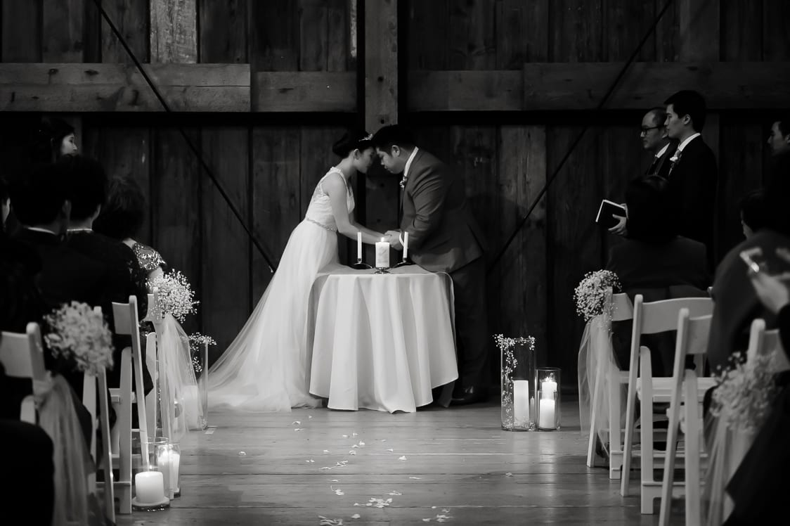 Bride and groom praying together for the first time at the Pickering Barn in Issaquah, WA