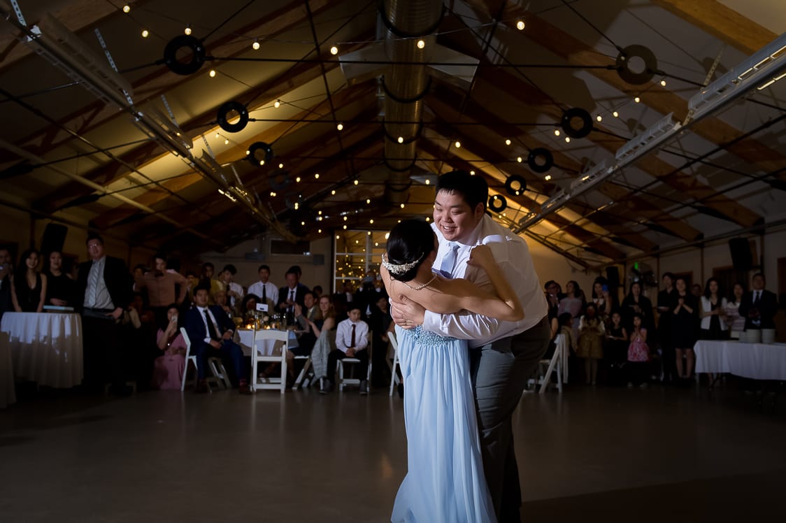 Groom dips bride during their first dance at the Pickering Barn in Issaquah, WA