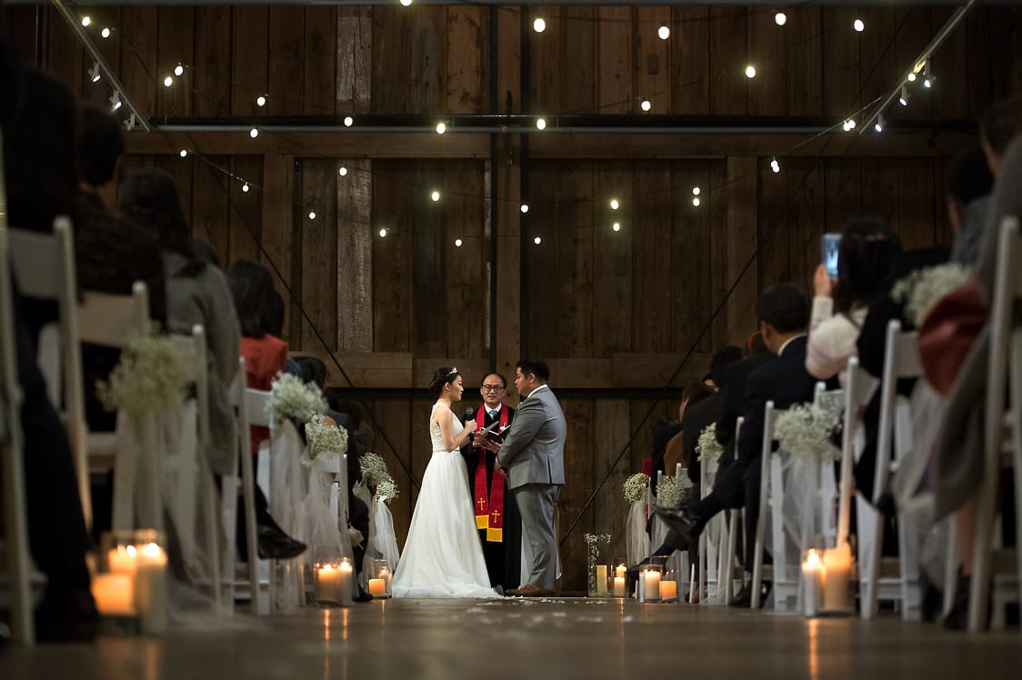 Bride and groom say their vows at the Pickering Barn in Issaquah, WA