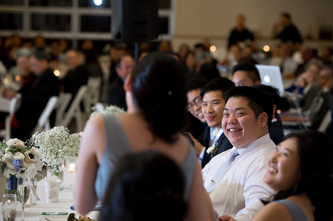 Groom smiling while listen to toasts at the Pickering Barn in Issaquah, WA