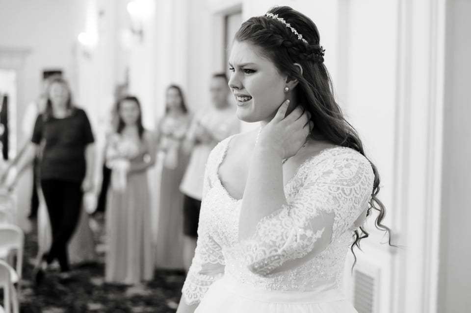 Bride gets emotional as she sees her groom for the first time at the Leopold Crystal Ballroom