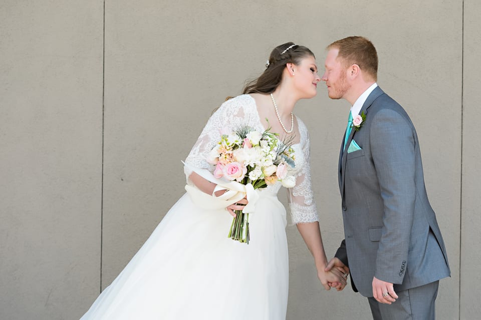 Bride and groom kiss at the Leopold Crystal Ballroom