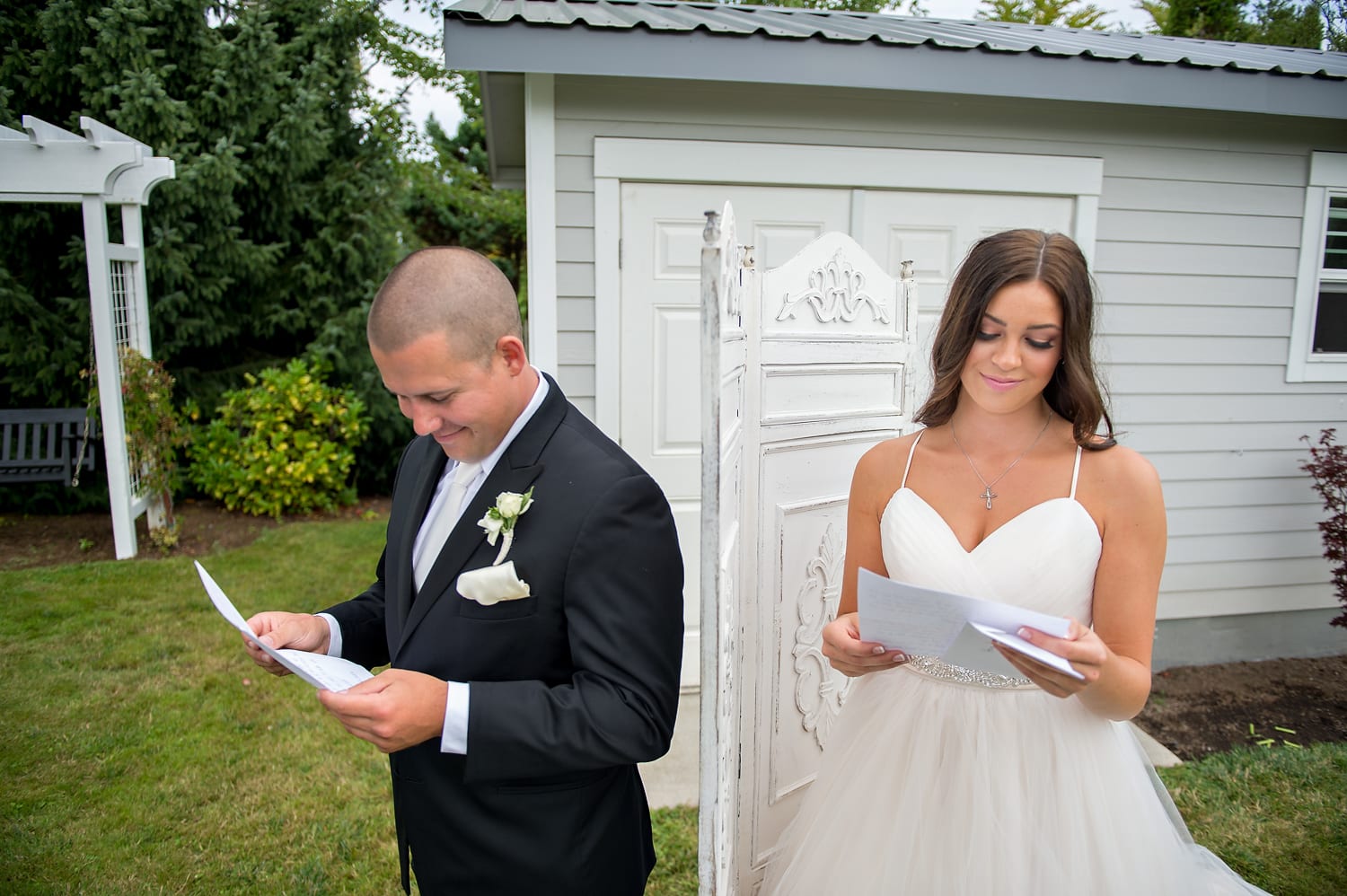 Bride and Groom reading letters at Axton Events Bellingham