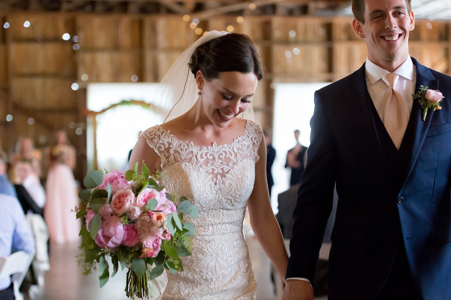 Bride and groom recessional at Maplehurst Farm wedding venue